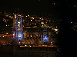 Ecuador Quito 07-08 Old Quito Cafe Mosaico Sunset View Of Basilica del Voto Nacional From Cafe Mosaico the lights of Old Quito came on, with this close up view of the Baslica del Voto Nacional, the tallest church in Ecuador with its twin 115m towers, modeled after the Cathedral of Notre Dame in Paris.